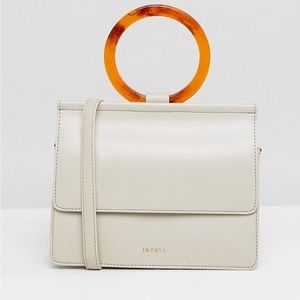 INYATI cross body bag with resin grab handle